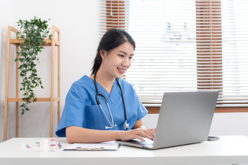 veterinarian woman in blue uniform is using laptop 2023 11 27 05 10 19 utc